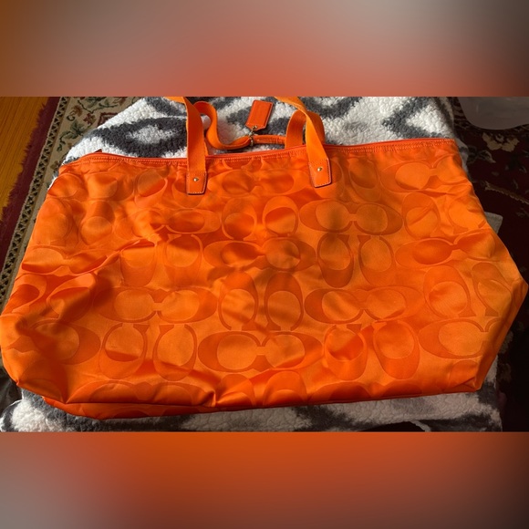 Orange Coach-like design duffel bag with removable inside zipper pouch. - Picture 2 of 7